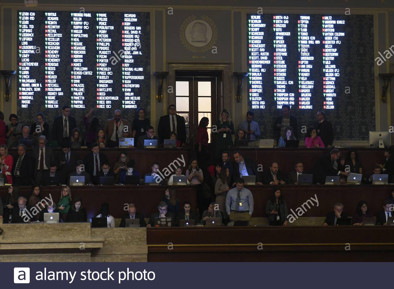 washington district of columbia usa 18th dec 2019 votes of representatives are pictured on a screen as speaker of the united states house of representatives nancy pelosi democrat of california presides over resolution 755 articles of impeachment against us president donald j trump as the house votes at the us capitol in washington dc on december 18 2019 the us house of representatives voted 229 198 on wednesday to impeach us president donald j trump for obstruction of congress the house impeached trump for abuse of power by a 230 197 vote credit zuma press incalamy live n 2AGEY0W
