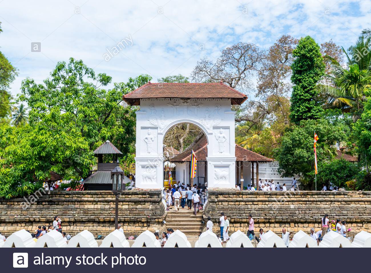 buddhist pilgrims walking into the shrine of sri dalada maligawa or the temple of the sacred tooth relic in kandy sri lanka celebrating the the ves 2ANTBFP