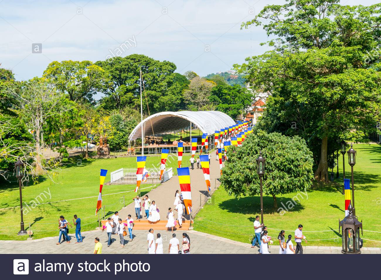 buddhist pilgrims walking into the shrine of sri dalada maligawa or the temple of the sacred tooth relic in kandy sri lanka celebrating the the ves 2ANTB4P