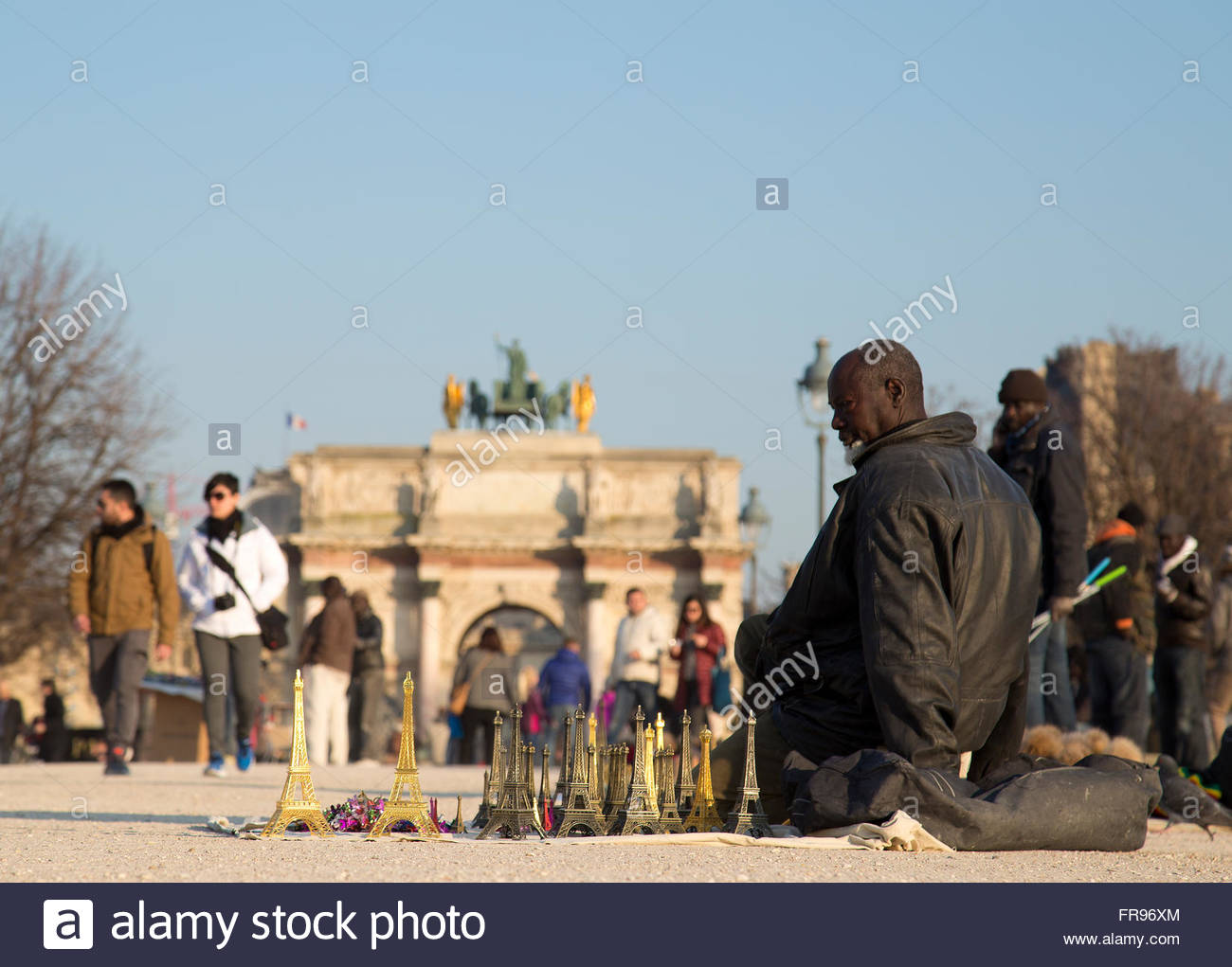 african migrant selling souvenirs in the jardin des tuileries in paris FR96XM