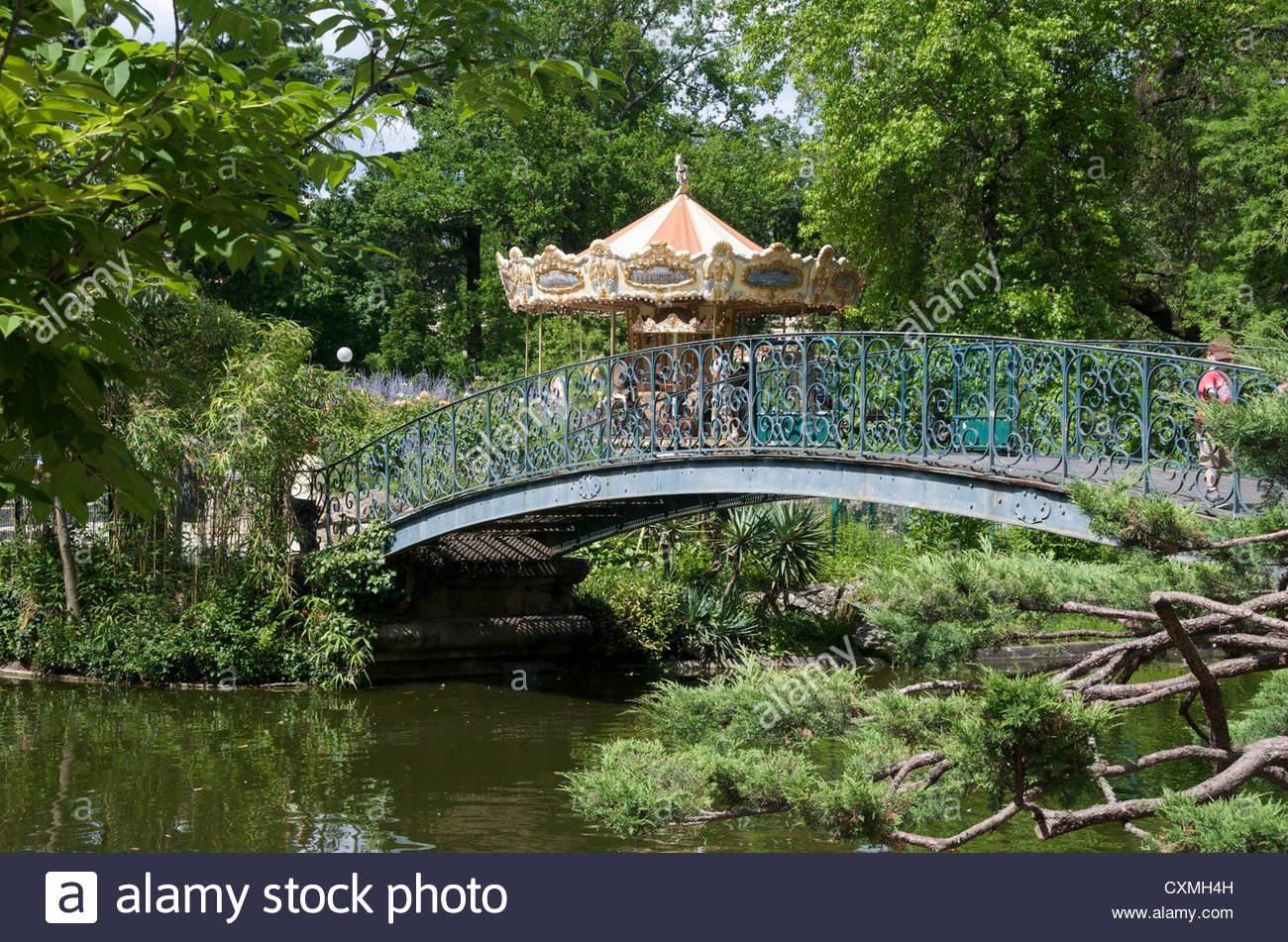 jardin public bordeaux gironde france with carousel ride in the background CXMH4H