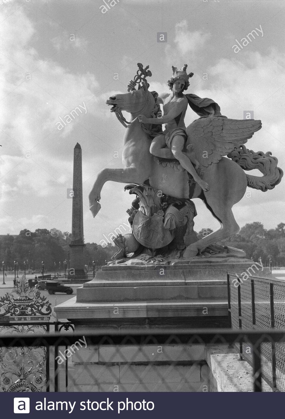 reportage paris description image mercure at the entrance of the jardin des tuileries annotation the sculptures mercure and la renomme are by antoine coysevox 1640 1720 they were placed in 1719 at the western entrance of the tuileries date 1935 location france paris keywords sculptures city sculptures 2APE9X9